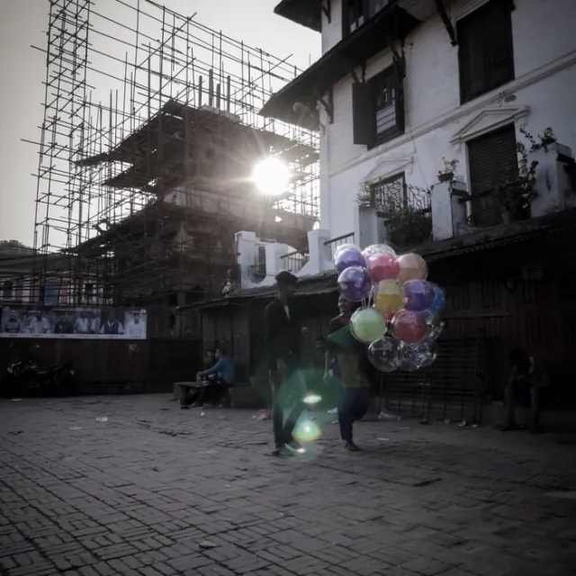 Balloon seller at dusk