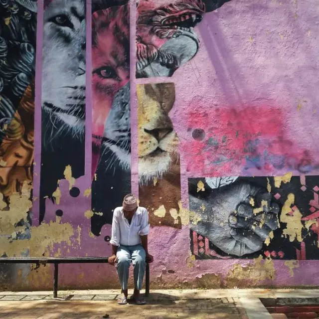 Man before street mural